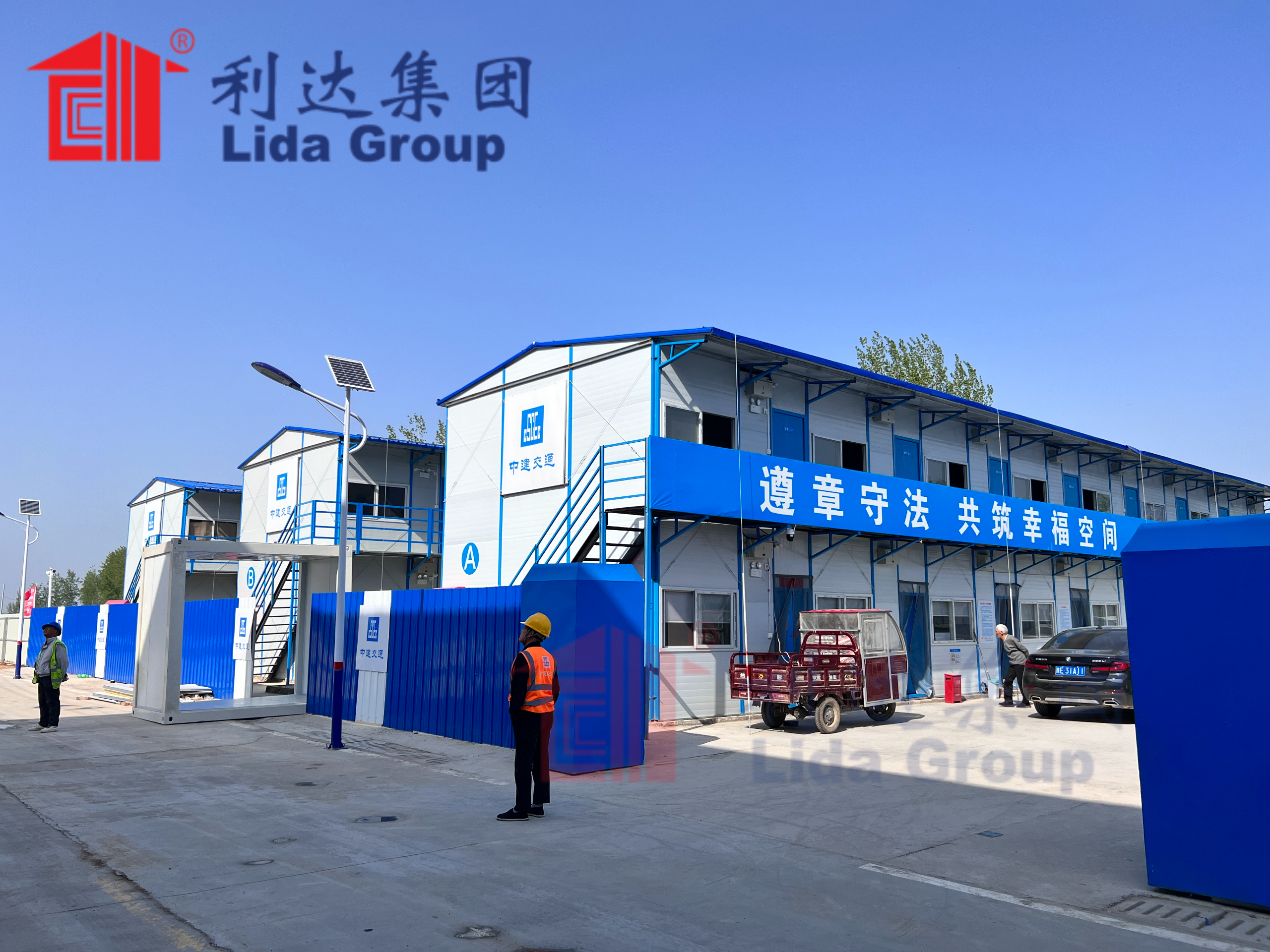 Government allocates funds to pilot temporary prefab complexes supplied by Lida Group featuring integrated renewable power systems, improved WASH facilities and communal units constructed from insulated sandwich panels.