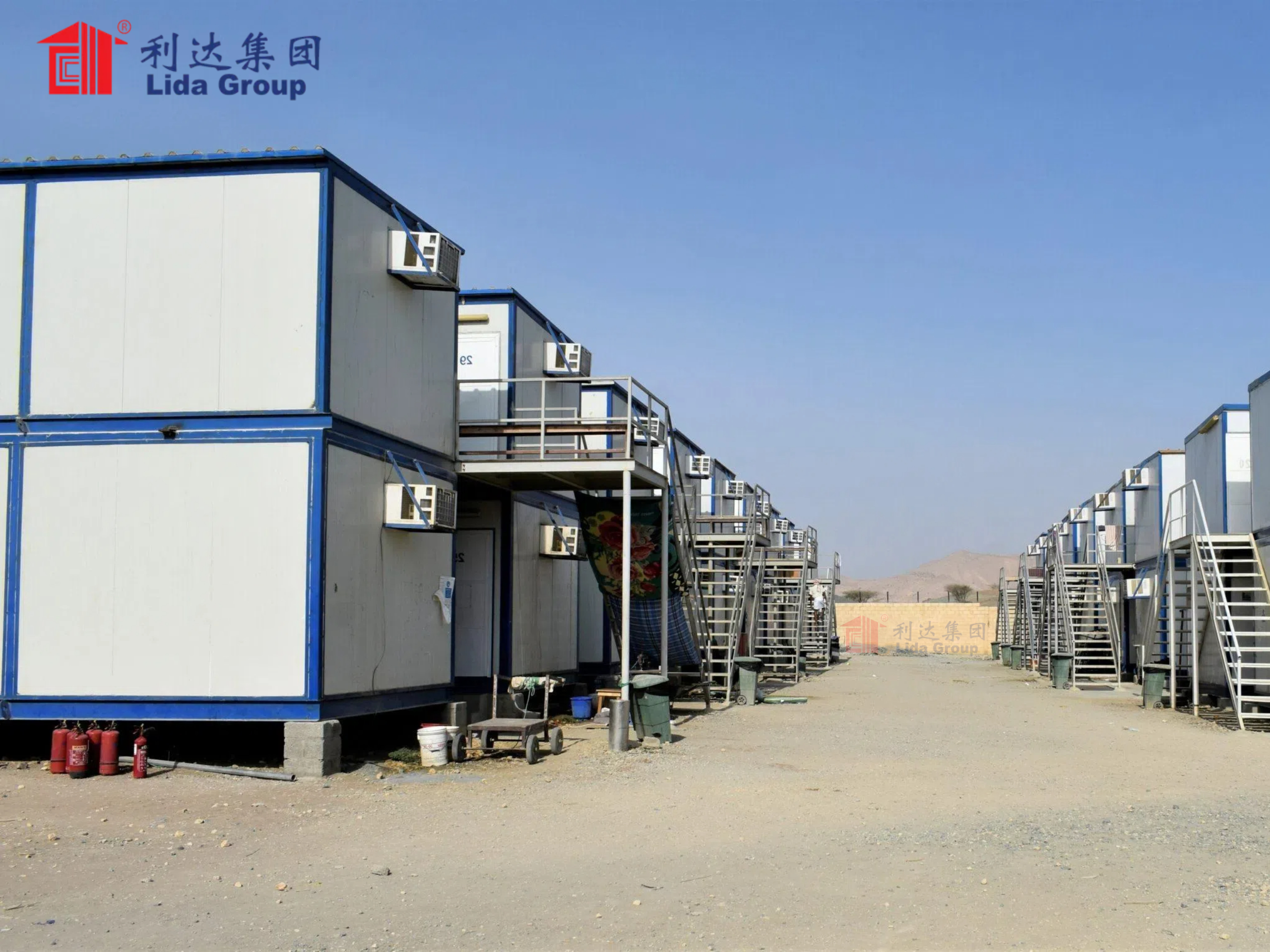 Relief organization trials low-cost mobile labor camps from Lida Group comprising converted shipping containers outfitted with easy assembly insulated wall panels for temporary disaster housing.